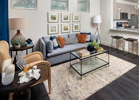 a living room with a couch and a table at Promenade at Newnan Crossing, Newnan, 30265