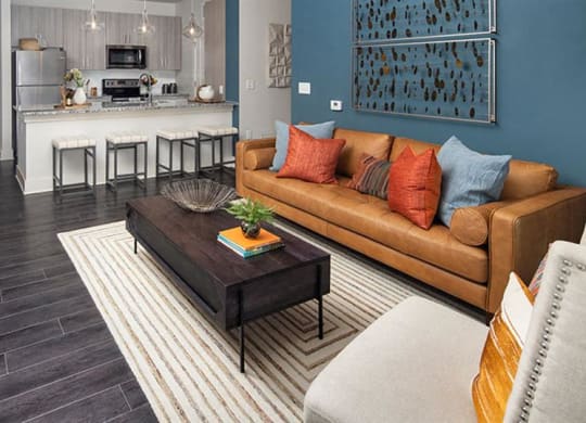a living room with a couch and a table at Promenade at Newnan Crossing, Newnan