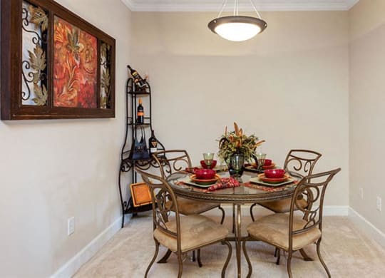 a dining room with a table and chairs at Bedford Parke Apartments, Georgia, 31088