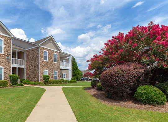 a sidewalk in front of an apartment building at Bedford Parke Apartments, Georgia, 31088