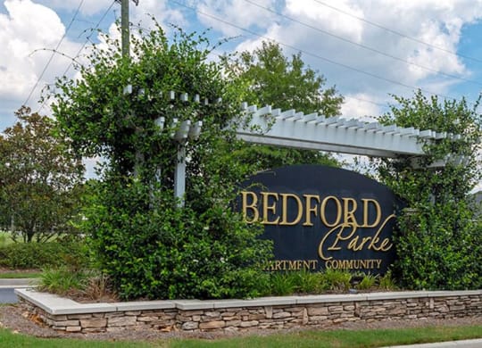a sign on the side of the road at Bedford Parke Apartments, Warner Robins, GA