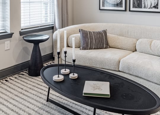 a living room with a couch and a coffee table at The Louis Apartment Flats, Kentucky