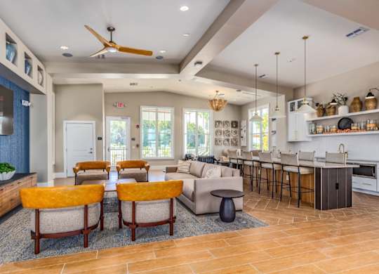 A modern kitchen with a dining area and a living room.