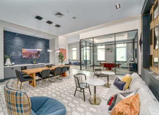 a living room with couches and chairs and a dining room with tables