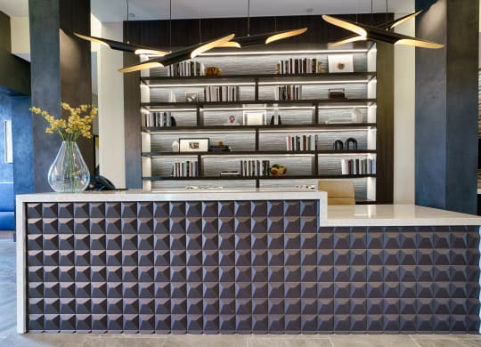 a reception desk with a purple and white design