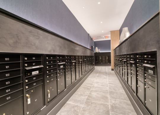 the mail room in the building has thousands of mailboxes