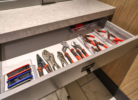 a drawer with a bunch of tools in it
