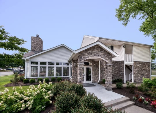 the front of a home with a stone and siding exterior at Misty Ridge Apartments, Virginia, 22191