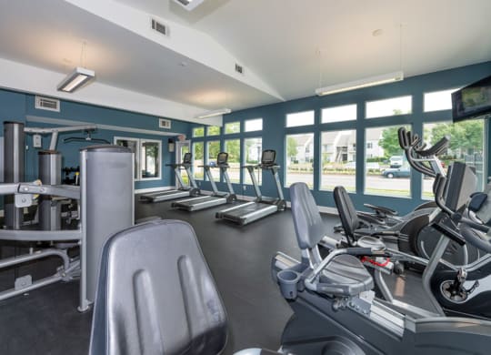 a gym with cardio equipment and windows at Misty Ridge Apartments, Woodbridge, 22191