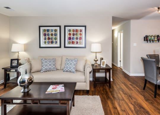 a living room filled with furniture and a large window at Misty Ridge Apartments, Woodbridge, VA