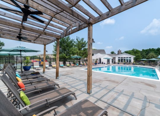 take a dip in the pool at villas at houston levee west apartments in cord at Misty Ridge Apartments, Woodbridge, VA 22191
