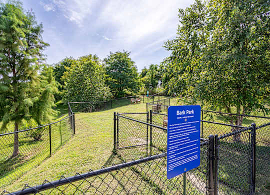 A sign in Bark Park lists rules and regulations.