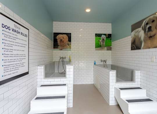 A dog wash station with a sign on the wall.