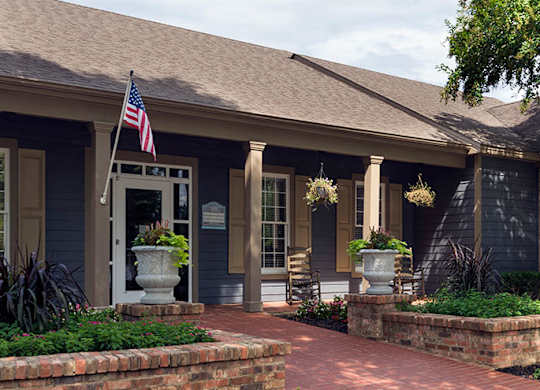 A house with a flag on the porch at Austin Chase Apartments, Macon, GA 31210