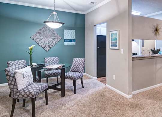 A dining room with a table and chairs at Austin Chase Apartments, Macon, GA 31210