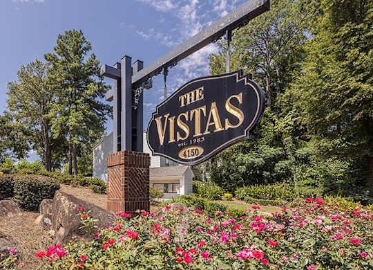 A sign for The Vistas reads 150.