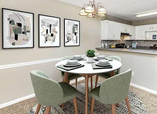 A dining room with a table set for two and a kitchen area in the background.