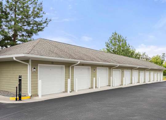 Private garage units with white doors at Colony at Centerpointe Apartments, Midlothian