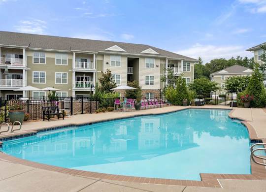 Resort style swimming pool with lounge seating at Colony at Centerpointe Apartments, Midlothian, 23114