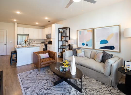 a living room with a couch and a table at The Quincy Apartments, Georgia