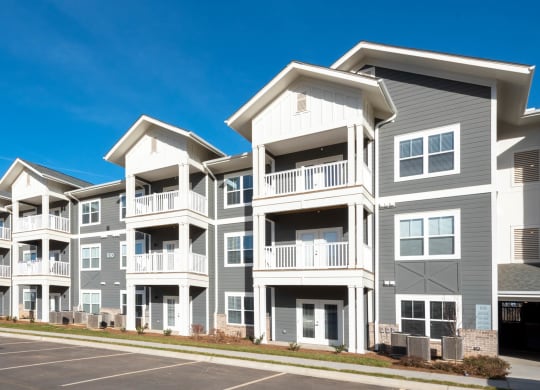 a row of new apartment buildings on a street at Retreat at Arden Farms, Arden North Carolina