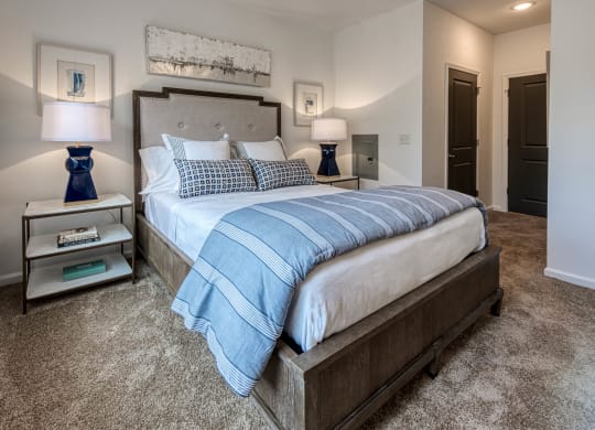 a bedroom with a large bed and two night stands at Retreat at Arden Farms, Arden, NC 28704