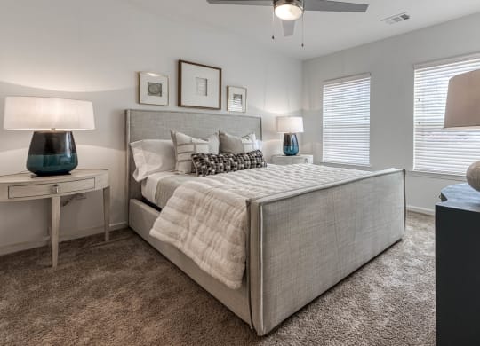 a bedroom with a large bed and two windows at Retreat at Arden Farms, Arden, 28704