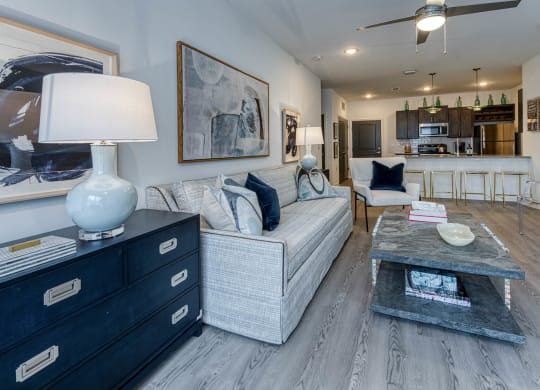 a living room filled with furniture and a table with a lamp at Retreat at Arden Farms, Arden North Carolina