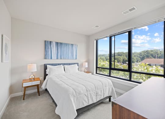 a bedroom with a bed and a large window at Rivergate, Virginia