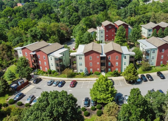 an aerial view of an apartment complex with cars parked in a parking lot at Skyloft, North Carolina, 28803