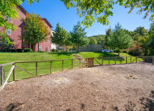a fenced in area with trees and a fence at Skyloft, Asheville, NC 28803