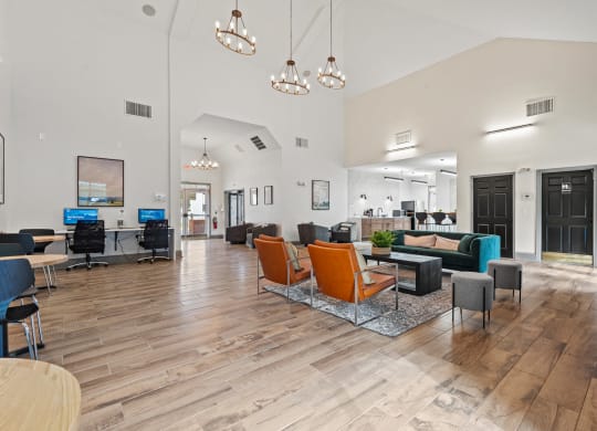 a large lobby with chairs and couches and a reception desk at SomerHill Farms Apartments, Gainesville