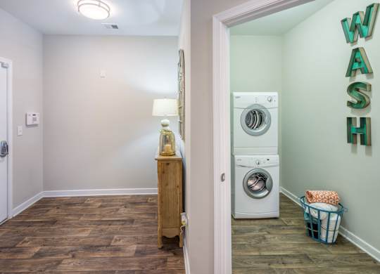 A laundry room with a washer and dryer.