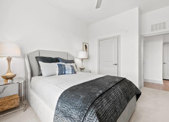 a bedroom with a bed and a nightstand at Tapestry West, Richmond