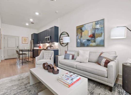 our apartments offer a living room with a couch and a coffee table at Tapestry West, VA 23230