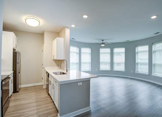 A kitchen with a large island in the middle of the room.