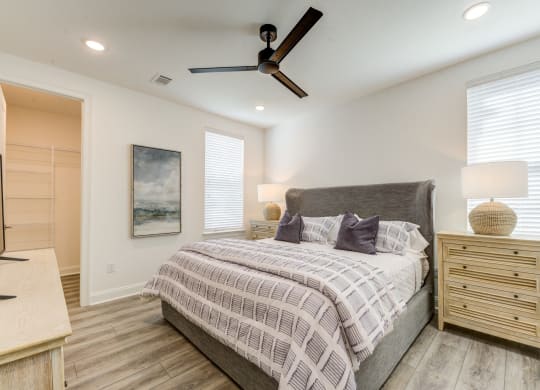 a bedroom with a bed and a ceiling fan at Residences at 393 North Apartments, Florida