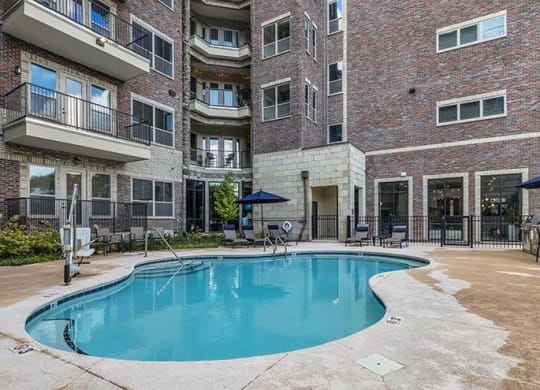 a swimming pool is in front of a brick building at 17 Broad, Tennessee, 37408