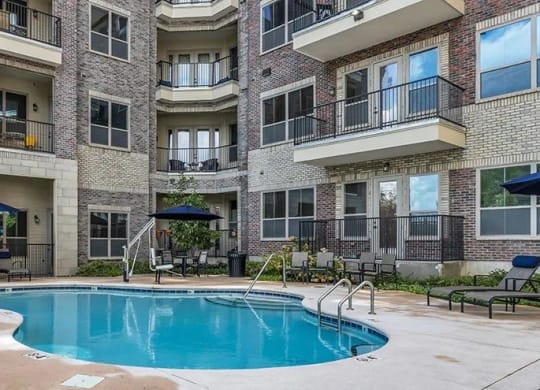 a large swimming pool in front of an apartment building at 17 Broad, Chattanooga, TN