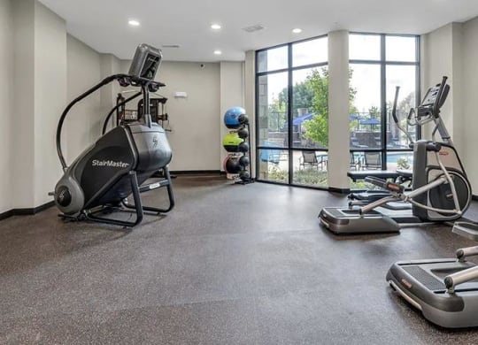 a gym with exercise equipment on the floor and a window at 17 Broad, Chattanooga, TN 37408