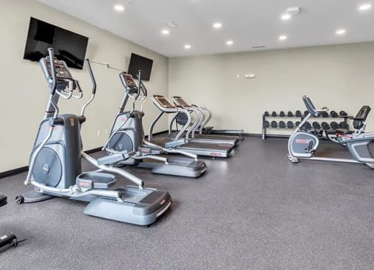 a gym with cardio equipment and weights on the floor at 17 Broad, Tennessee