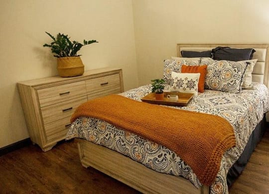 a bedroom with a bed and two night stands at 17 Broad, Chattanooga