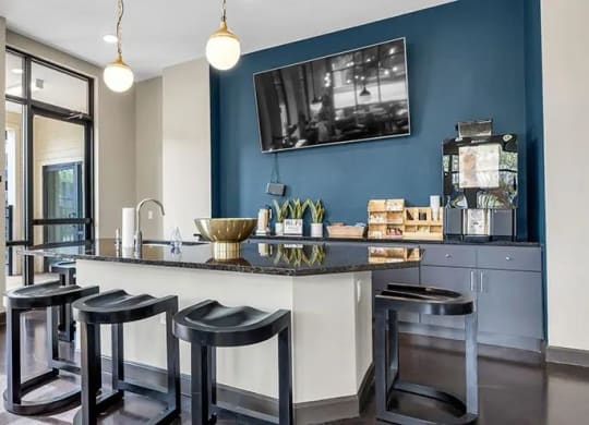 a kitchen with a bar and stools at 17 Broad, Tennessee