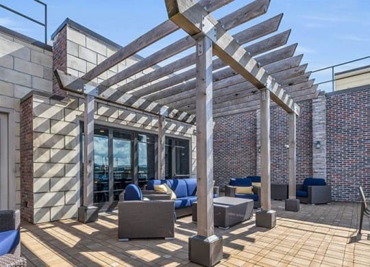 the patio of a building with furniture and awnings at 17 Broad, Chattanooga