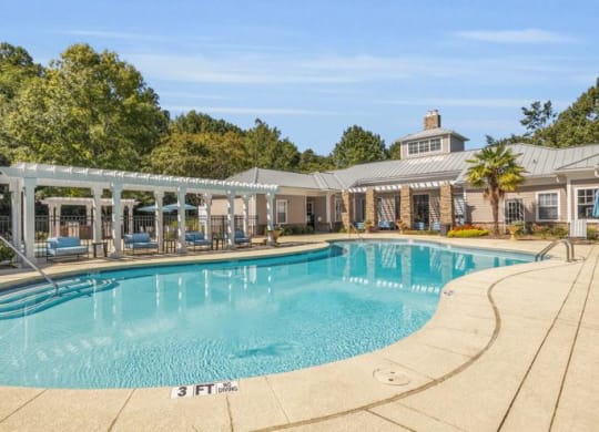 a large swimming pool with a house in the background at Marina Point, Chattanooga, 37415