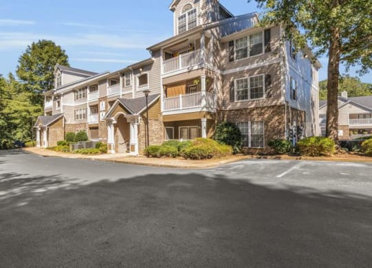 an empty parking lot in front of an apartment building at Marina Point, Chattanooga, TN 37415