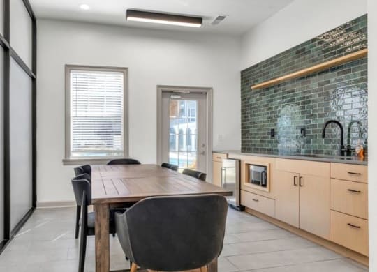 a dining room with a wooden table and black chairs at Marina Point, Chattanooga, TN 37415
