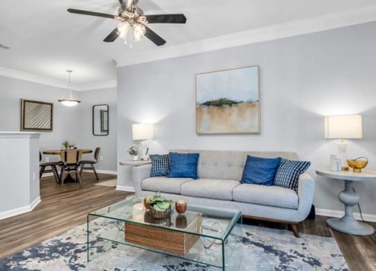 a living room with a couch and a glass coffee table at Marina Point, Chattanooga, 37415