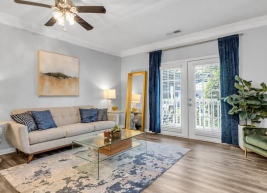 a living room with a couch and a glass table at Marina Point, Chattanooga, TN