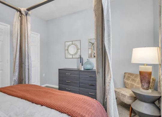 a bedroom with a bed and a large mirror at Marina Point, Chattanooga
